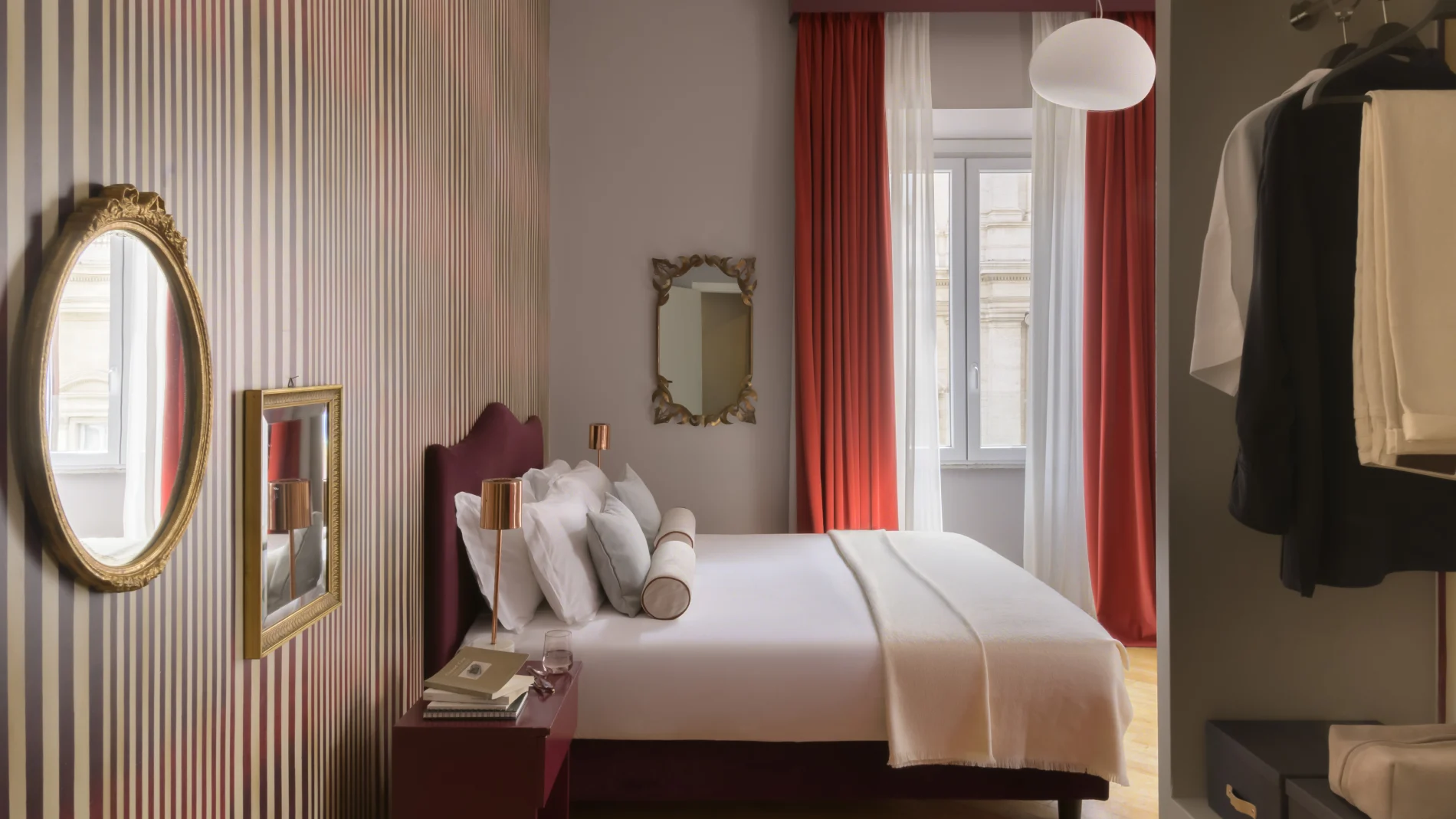 Junior Suite in Rome Monti district with double bed, striped wall, gilded mirrors, red curtains and open wardrobe - Salotto Monti, BZAR hotels in Rome